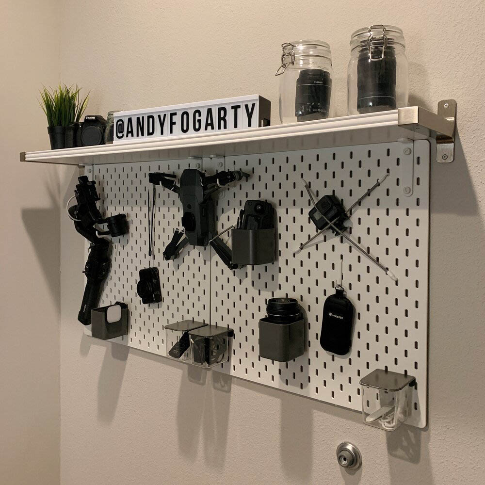 Andy’s office is full of thoughtful touches, like this custom shelving solution for his camera equipment.