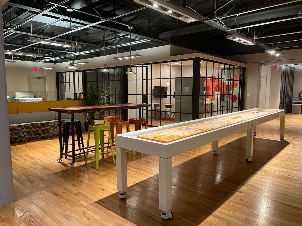 Coworking Shuffle Board Table Helps Reduce Burnout