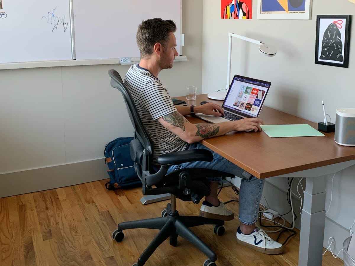 A man working on his laptop in a microoffice at fireworks coworking, marietta, atlanta, georgia